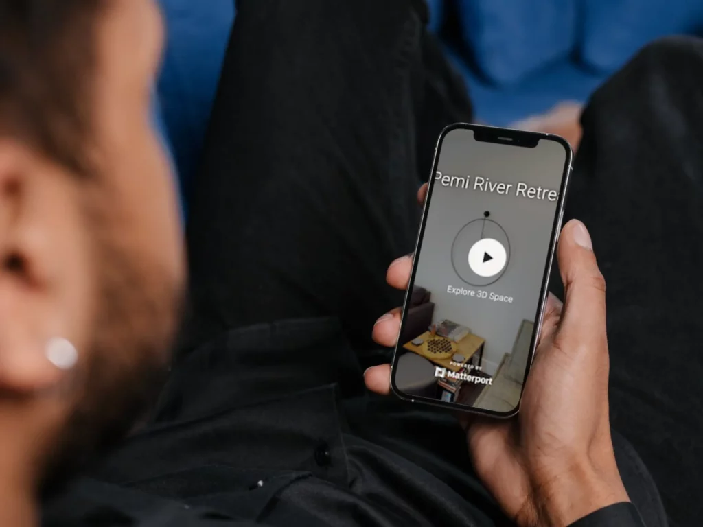 Man holding a phone with ParadeSmart virtual tours