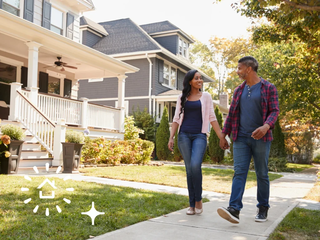 A couple walking in front of a home event
